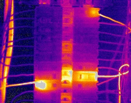 Electrical panel with an overloaded breaker identified during inspection